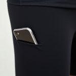 Close-up of the fabric and stitching on long bike shorts with phone pocket leggings, highlighting quality material and texture.
