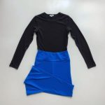 Royal Blue long sleeve yoga top womens with black flared leggings folded neatly, flat lay on neutral surface.