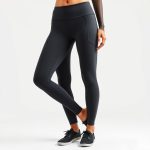 Black pocket yoga pants in charcoal colour on white background, photorealistic e-commerce product image.