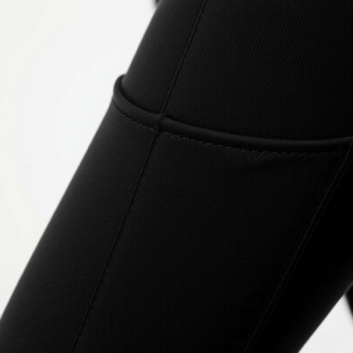 Close-up of black pocket yoga pants showcasing Cashmere Blend fabric texture and stitching detail.