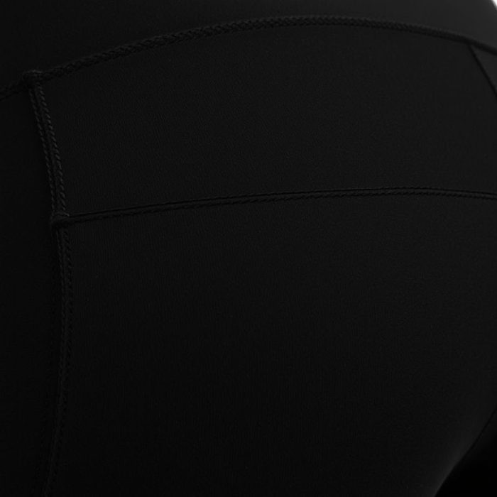 Close-up of high-quality fabric and stitching on black cycling shorts leggings with pockets for women.