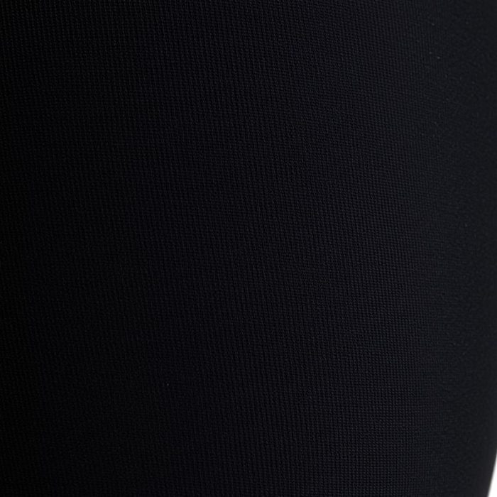 Close-up of black flared leggings fabric, highlighting scrunch bum detail, stitching, and premium material quality.