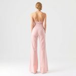 Back view of black wide leg yoga pants scrunch legging in Pastel Pink, showcasing fit on model, white studio background.
