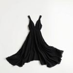 Black boho clothing brand chai loose leaf top on a clean white studio background.