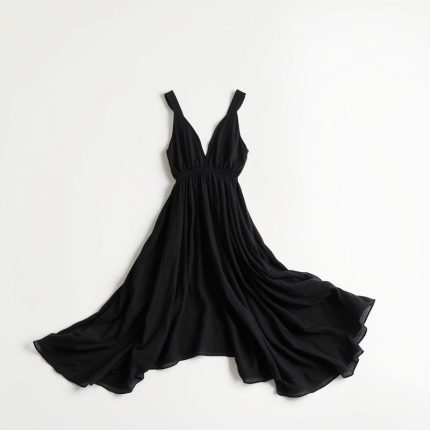 Black boho clothing brand chai loose leaf top on a clean white studio background.