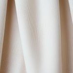 Close-up detail of the soft organic cotton fabric and stitching on our flare yoga pants australia.
