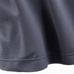 Close-up of polyester-cotton blend golf skorts scrunch bum leggings, highlighting texture and stitching quality.