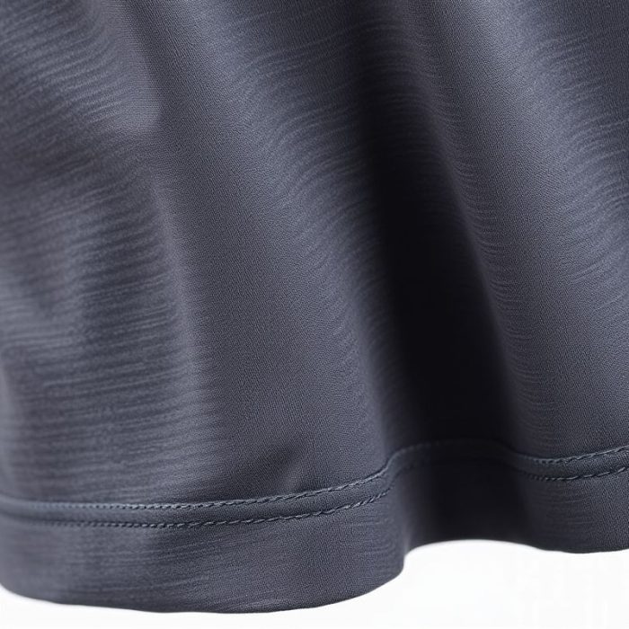 Close-up of polyester-cotton blend golf skorts scrunch bum leggings, highlighting texture and stitching quality.