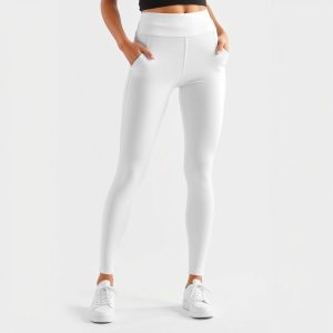 White high waist leggings with pockets for workouts, studio shot on white background.