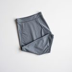 High waist leggings in Heather Grey, bum-sculpting leggings Australia, neatly folded on a neutral surface, top-down view.