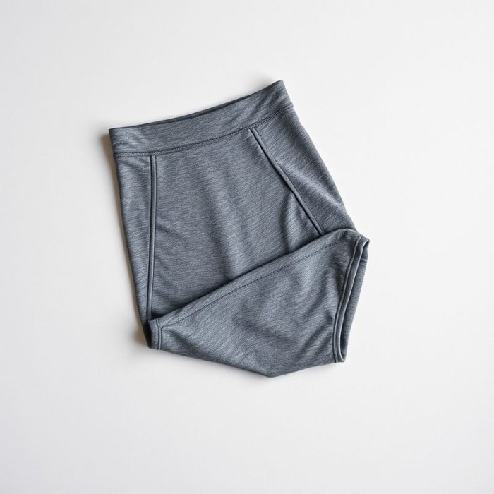 High waist leggings in Heather Grey, bum-sculpting leggings Australia, neatly folded on a neutral surface, top-down view.