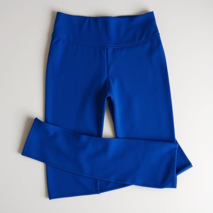 Royal Blue high waist leggings with pockets, neatly folded on a neutral surface, flat lay top-down view.