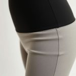 Close-up of high waisted leggings scrunch bum activewear fabric, showing linen texture and quality stitching.