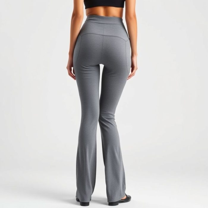 A model wearing high waisted yoga pants straight leg yoga pants in Heather Grey, back view, studio shot on white background.