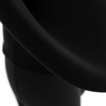 Close-up of black seamless leggings and long sleeve yoga tops fabric, highlighting recycled material texture and stitching quality.