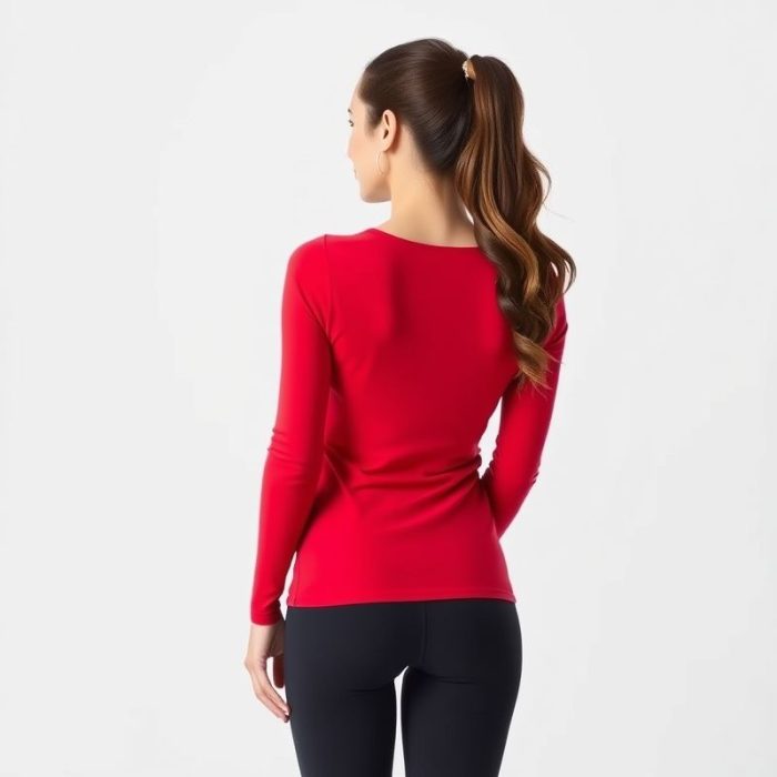 Back view of a model in red long sleeve yoga tops with black seamless leggings, studio shot on white background.