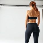 Back view of charcoal organic cotton yoga pants, sustainable activewear Australia, on model.
