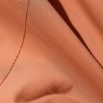 Close-up detail of the rose skirt byron bay cacao fabric texture and stitching.