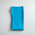 Sky Blue seamless leggings black high waisted leggings folded neatly on a neutral surface, top-down view.
