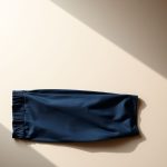 Navy Blue bamboo wide leg yoga pants folded flat on a neutral surface.