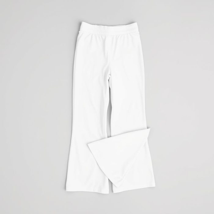 Flat lay of white wide leg yoga pants Australia, flare black yoga pants folded neatly on a neutral surface.