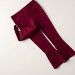 Burgundy yoga crop flare leggings folded flat on a neutral surface.
