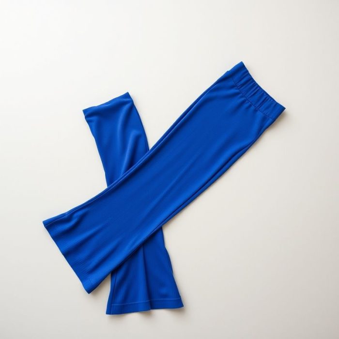 Royal Blue ribbed flared leggings folded neatly on a neutral surface, yoga pants flare style.