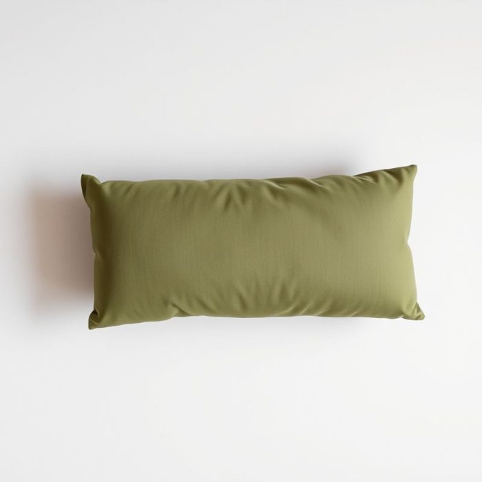 Flat lay of an olive green yoga pillow bolster neatly folded on a neutral surface, minimalist e-commerce style.