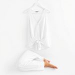 White organic knit yoga set from Australia on a clean white background.