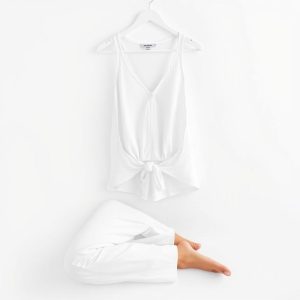 White organic knit yoga set from Australia on a clean white background.