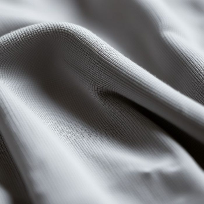 Close-up of the organic yoga t shirt fabric texture and stitching made from recycled materials.